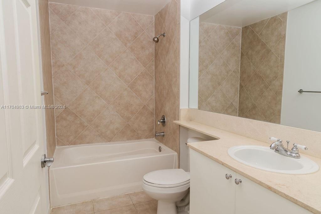 233 South Federal Highway, Unit 723 Boca Raton, FL 33432 - Photo 22 of 35 a bathroom with a sink a toilet and a bathtub