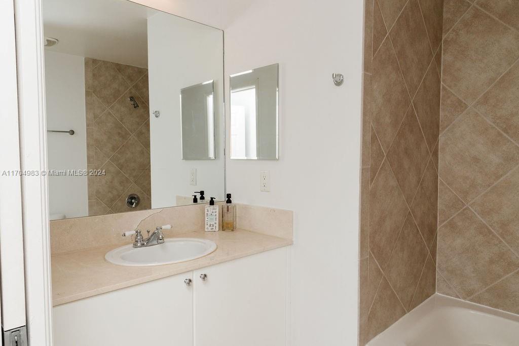233 South Federal Highway, Unit 723 Boca Raton, FL 33432 - Photo 24 of 35 a bathroom with a sink and a mirror