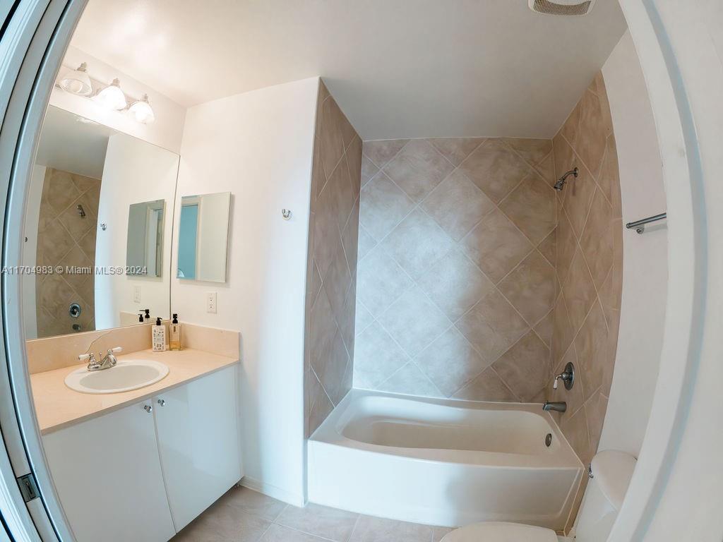 233 South Federal Highway, Unit 723 Boca Raton, FL 33432 - Photo 26 of 35 a bathroom with a tub sink and mirror