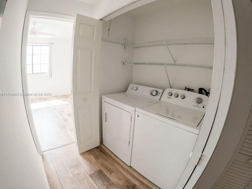 233 South Federal Highway, Unit 723 Boca Raton, FL 33432 - Photo 28 of 35 a utility room with dryer and washer