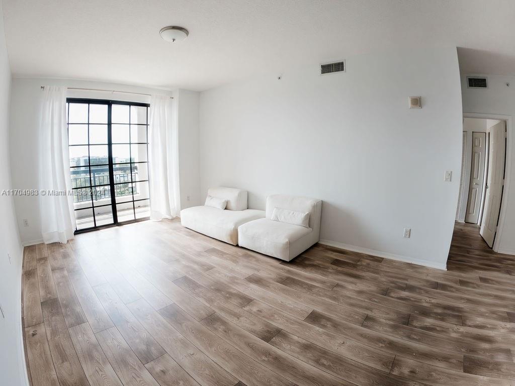 233 South Federal Highway, Unit 723 Boca Raton, FL 33432 - Photo 3 of 35 a spacious bedroom with a bed and a window