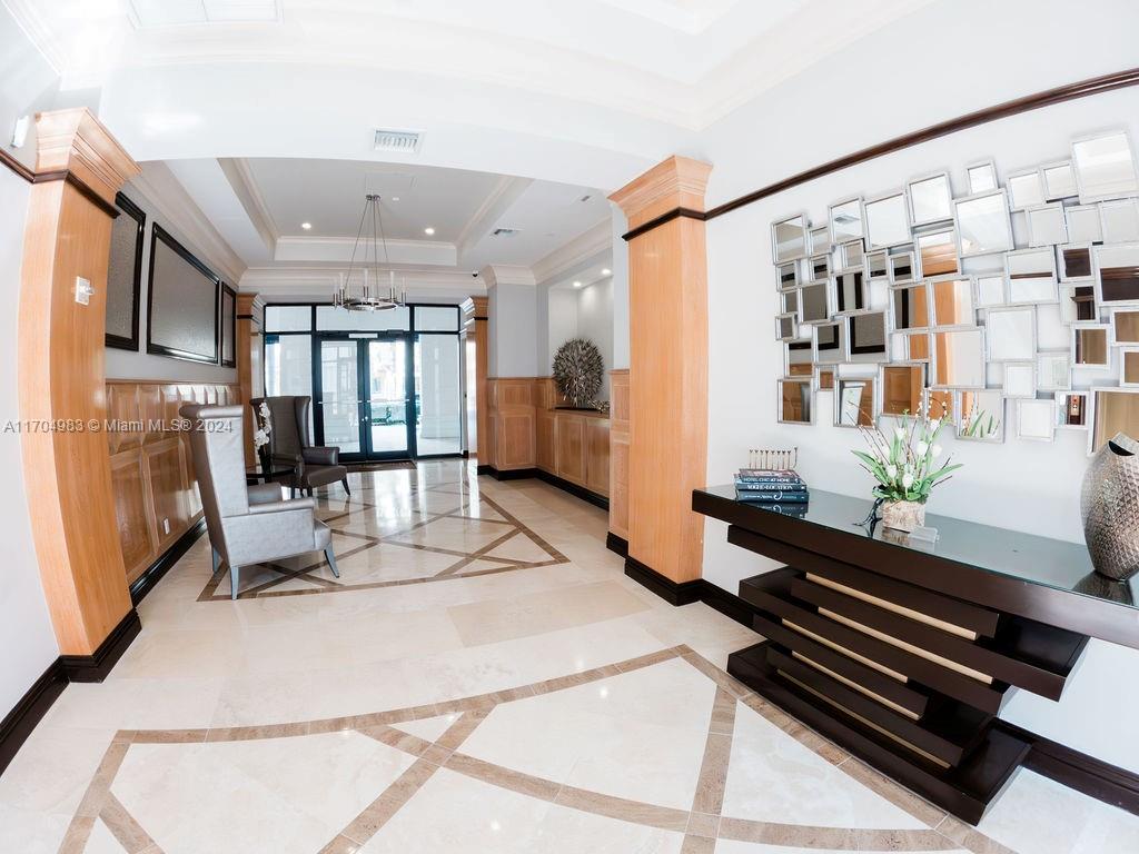 233 South Federal Highway, Unit 723 Boca Raton, FL 33432 - Photo 35 of 35 a living room with furniture and a flat screen tv