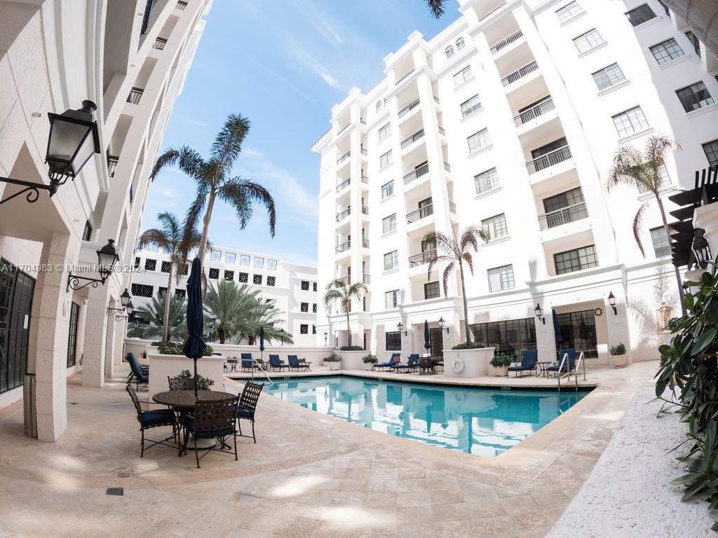 233 South Federal Highway, Unit 723 Boca Raton, FL 33432 - Photo 8 of 35 a view of a swimming pool with outdoor seating