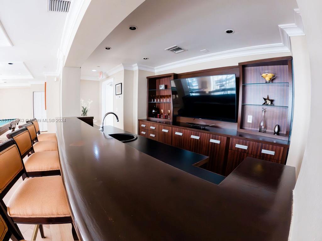 233 South Federal Highway, Unit 723 Boca Raton, FL 33432 - Photo 10 of 35 a living room with furniture and a flat screen tv