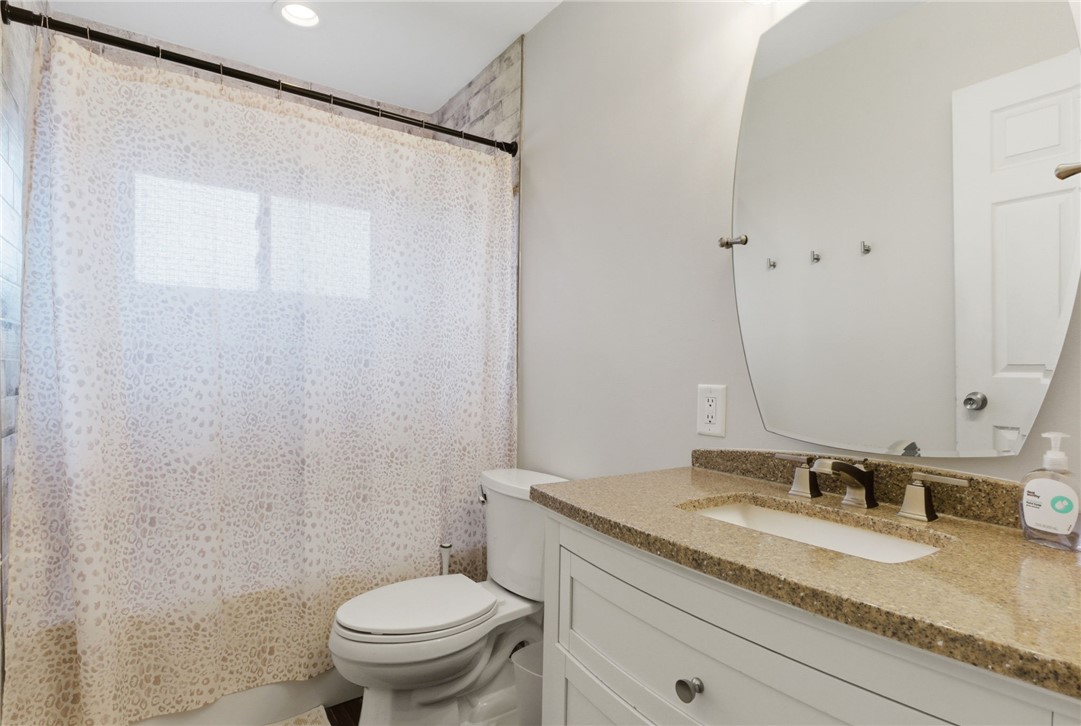 441 Townsend Place Riverside, OH 45431 - Photo 25 of 34 This bathroom features a contemporary vanity with a granite countertop and a sleek, modern mirror.