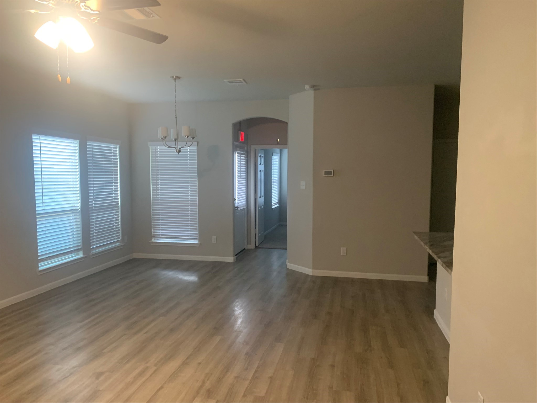 6511 Wenlock Drive Houston, TX 77048 - Photo 13 of 23 an empty room with wooden floor and windows