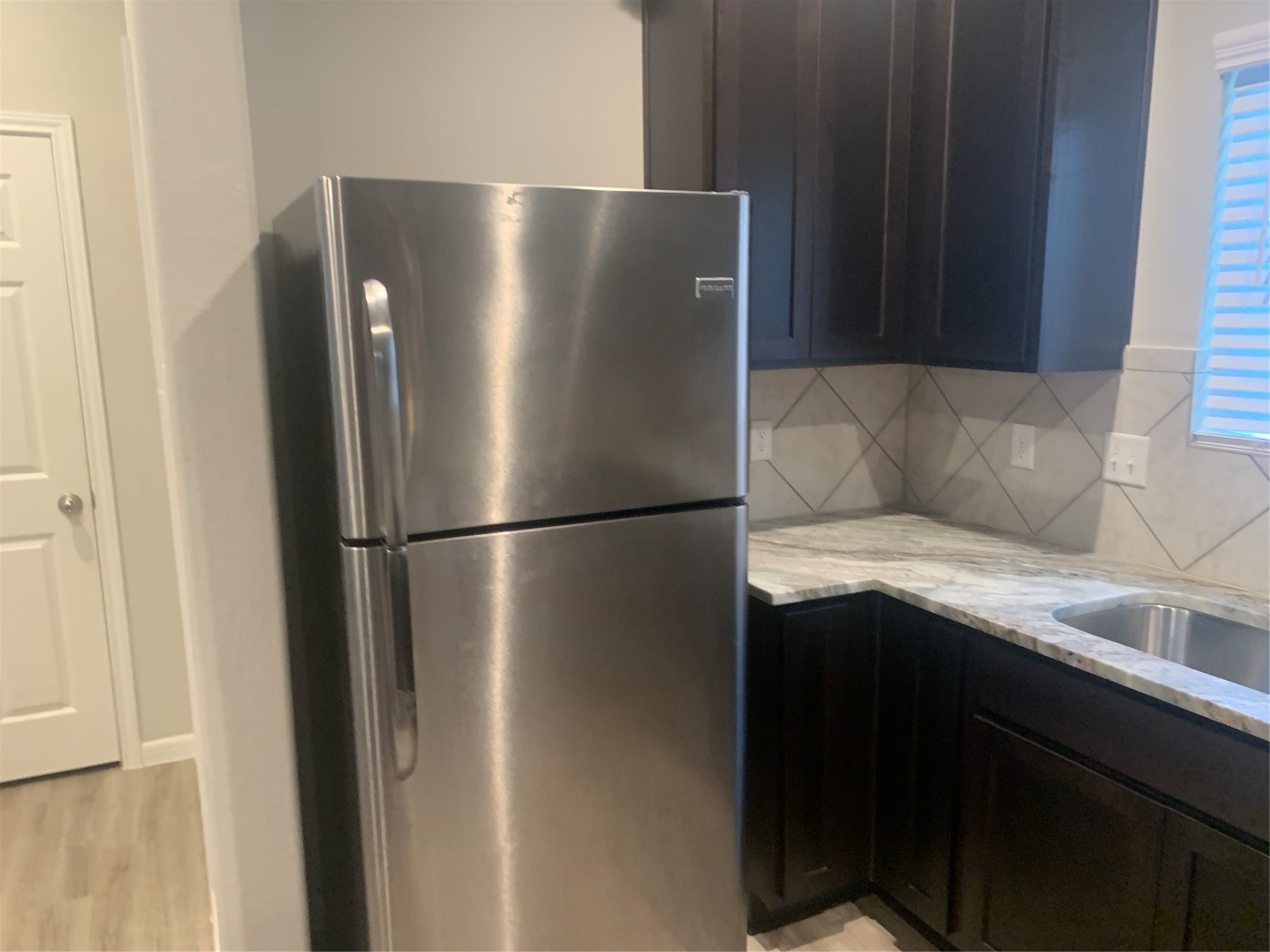 6511 Wenlock Drive Houston, TX 77048 - Photo 16 of 23 a kitchen with metallic refrigerator freezer and a dishwasher