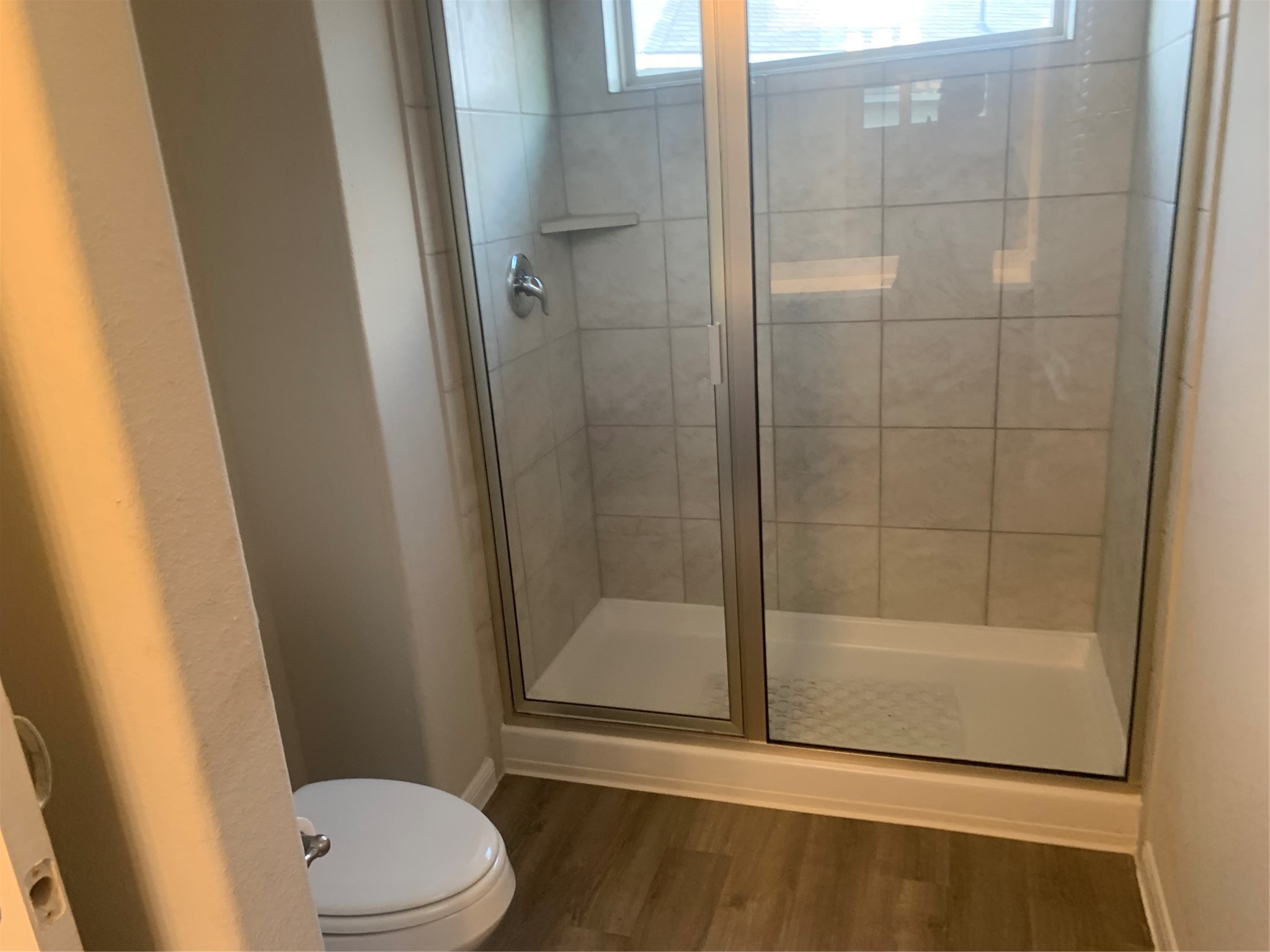 6511 Wenlock Drive Houston, TX 77048 - Photo 19 of 23 a bathroom with a shower and a toilet