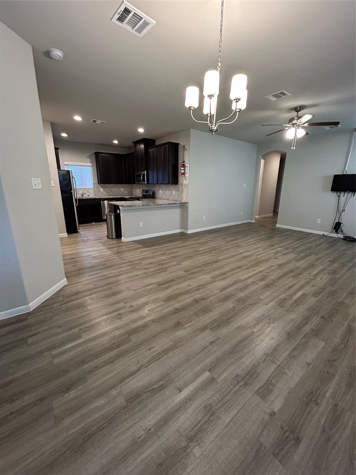 6511 Wenlock Drive Houston, TX 77048 - Photo 3 of 23 a view of a room with a chandelier furniture and a chandelier