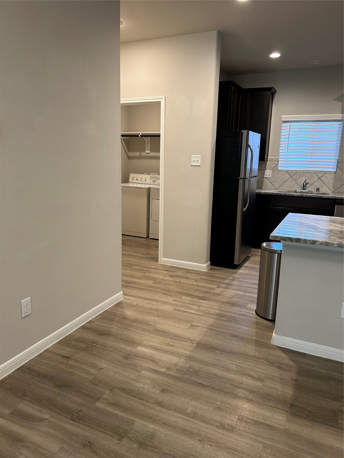 6511 Wenlock Drive Houston, TX 77048 - Photo 5 of 23 a kitchen with granite countertop a refrigerator and a stove