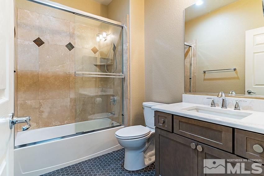 8170 Willow Ranch Trail Reno, NV 89523 - Photo 12 of 23 a bathroom with a sink toilet and shower
