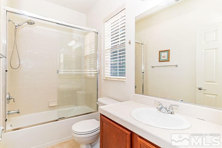8170 Willow Ranch Trail Reno, NV 89523 - Photo 18 of 23 a bathroom with a sink toilet and shower