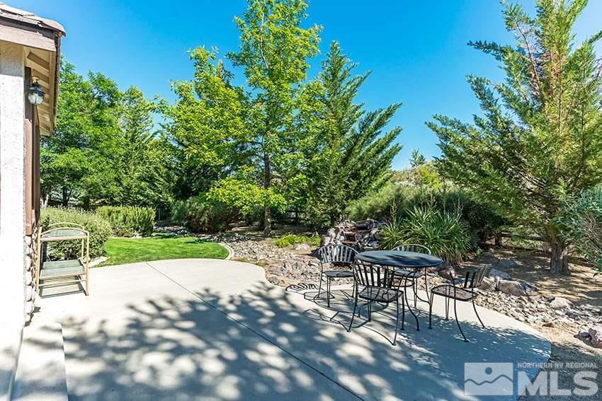 8170 Willow Ranch Trail Reno, NV 89523 - Photo 19 of 23 a view of backyard with seating and green space