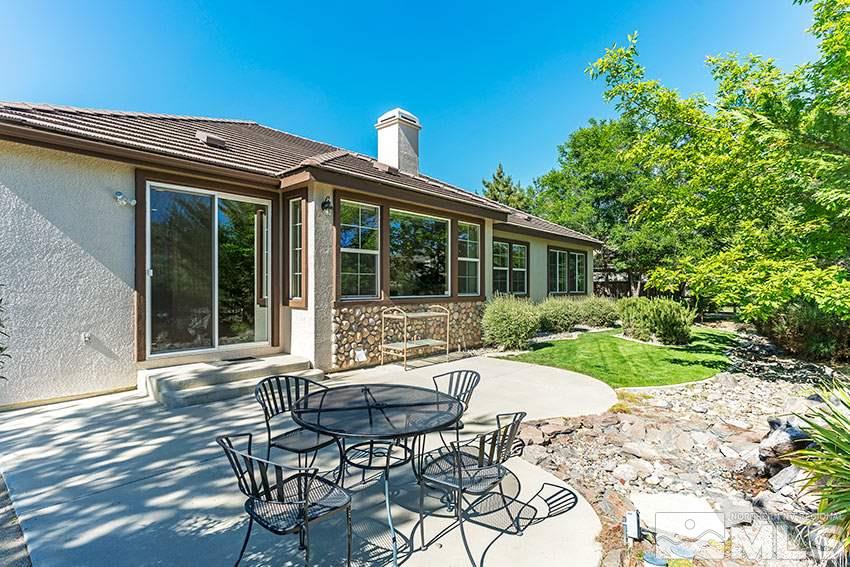 8170 Willow Ranch Trail Reno, NV 89523 - Photo 20 of 23 a view of a house with backyard sitting area and garden