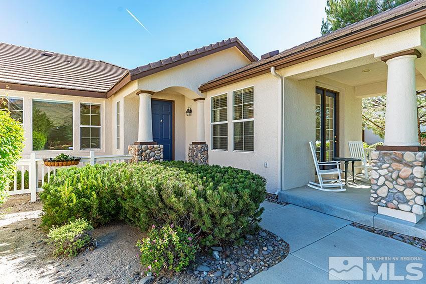 8170 Willow Ranch Trail Reno, NV 89523 - Photo 23 of 23 front view of a house with a large window and potted plants