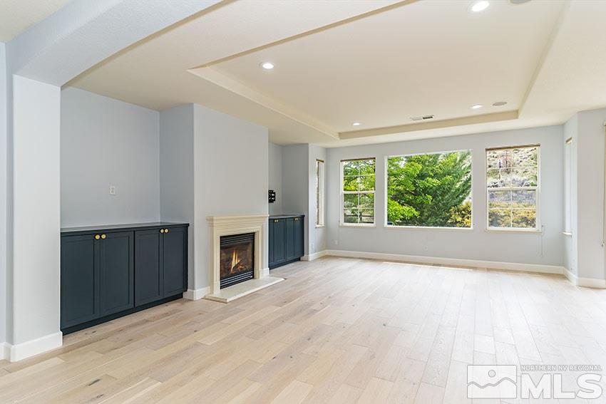 8170 Willow Ranch Trail Reno, NV 89523 - Photo 9 of 23 an empty room with windows and a fireplace
