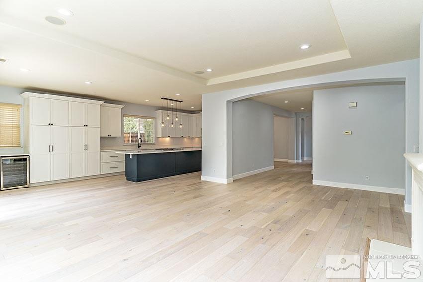 8170 Willow Ranch Trail Reno, NV 89523 - Photo 10 of 23 an empty room with kitchen and windows