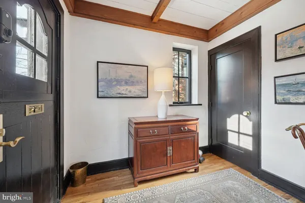 a room with furniture and mirror