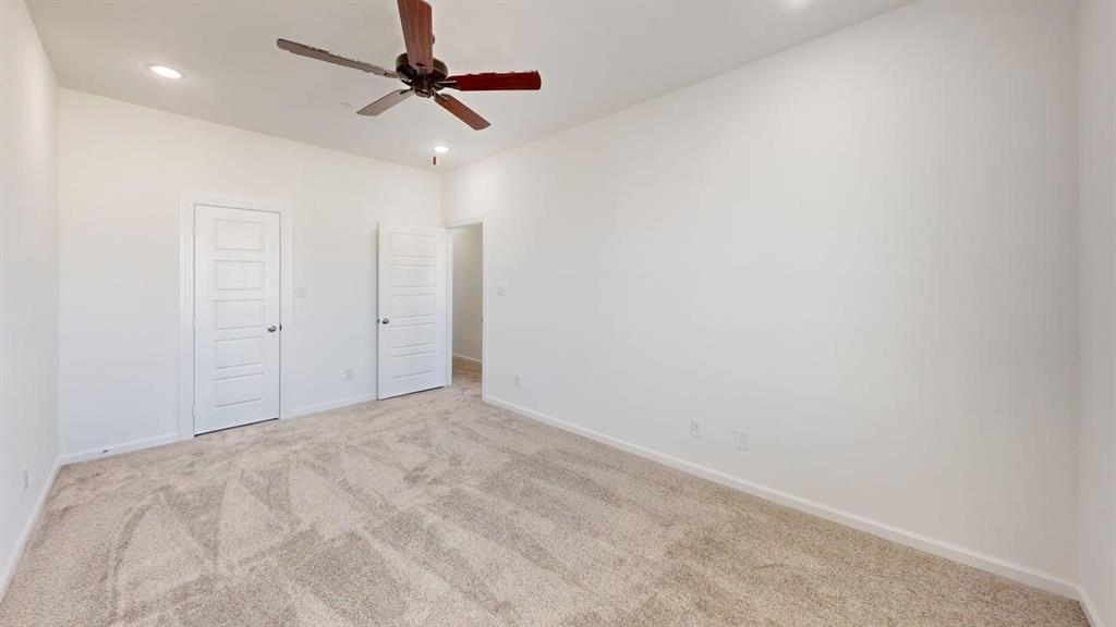 285 Buck Ridge Drive Frisco, TX 75068 - Photo 14 of 20 Unfurnished bedroom with light colored carpet, a ceiling fan, a closet, and recessed lighting