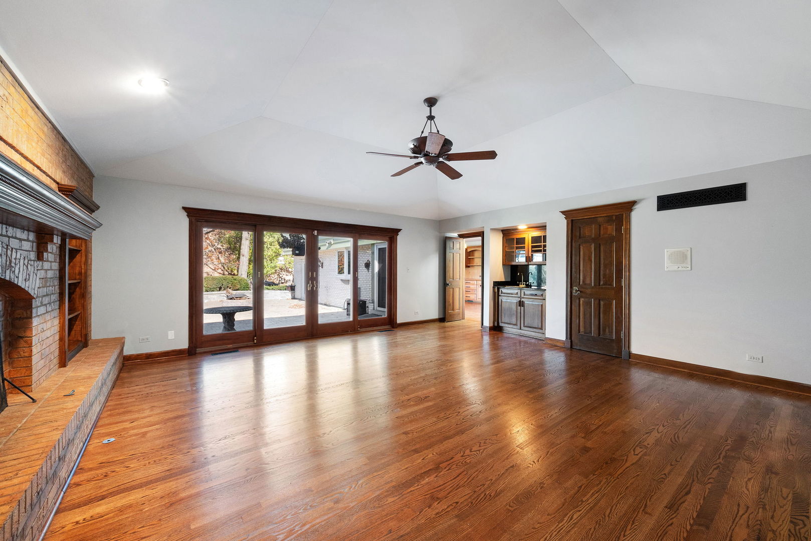 8282 Ridgepoint Drive Burr Ridge, IL 60527 - Photo 12 of 24 a view of an empty room with wooden floor and a window