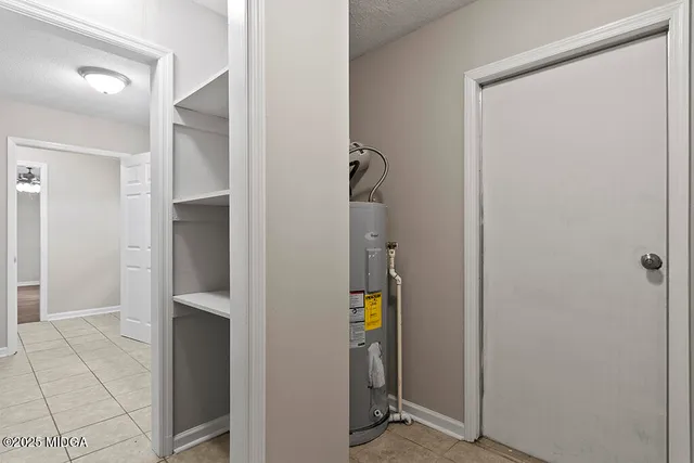 a kitchen with granite countertop a sink and a window
