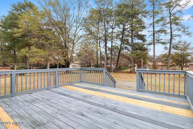 a view of a house with a yard and garage