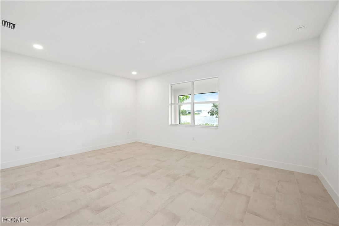 16236 Wax Myrtle Street Punta Gorda, FL 33982 - Photo 11 of 37 an empty room with windows