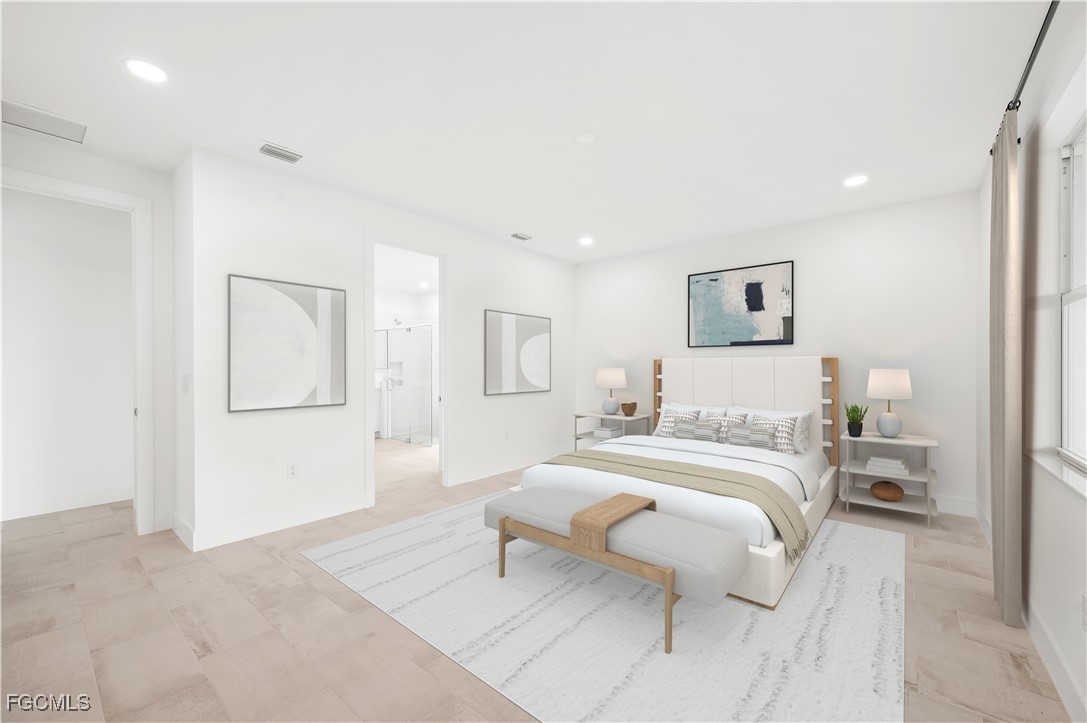 16236 Wax Myrtle Street Punta Gorda, FL 33982 - Photo 12 of 37 a spacious bedroom with a bed and a couch