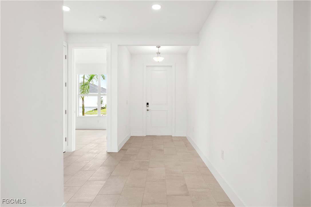 16236 Wax Myrtle Street Punta Gorda, FL 33982 - Photo 19 of 37 an empty room with windows and bathroom