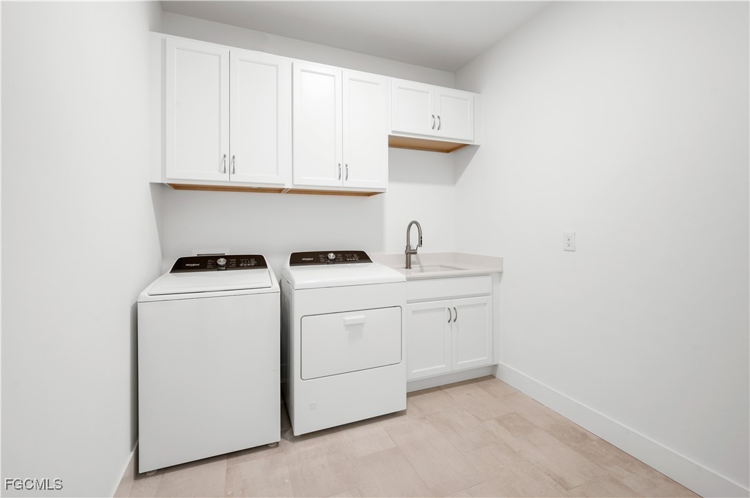 16236 Wax Myrtle Street Punta Gorda, FL 33982 - Photo 21 of 37 a utility room with dryer and washer