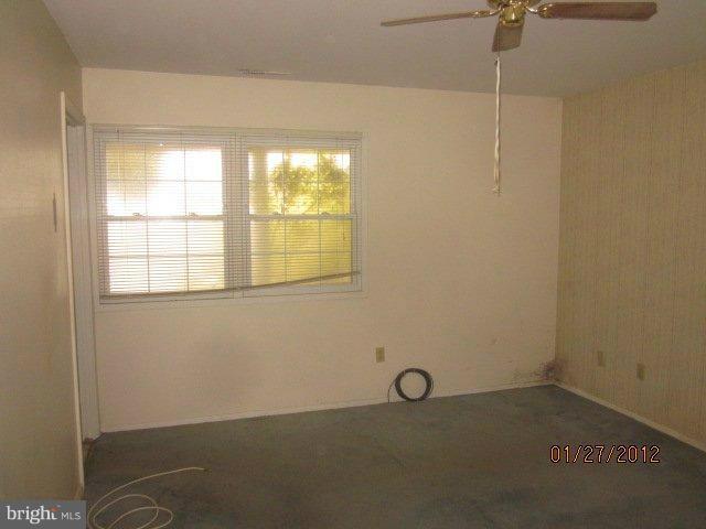 1915 Winder Road Windsor Mill, MD 21244 - Photo 3 of 7 an empty room with a window