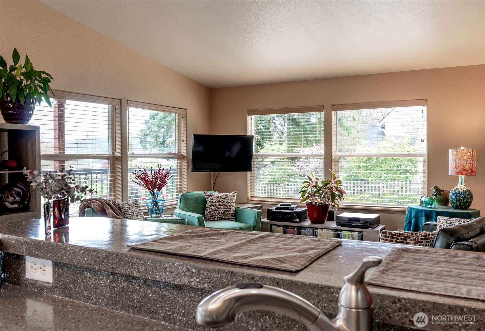 600 Northeast Lincoln Road, Unit 4 Poulsbo, WA 98370 - Photo 13 of 30 a living room with furniture large window and flat screen tv