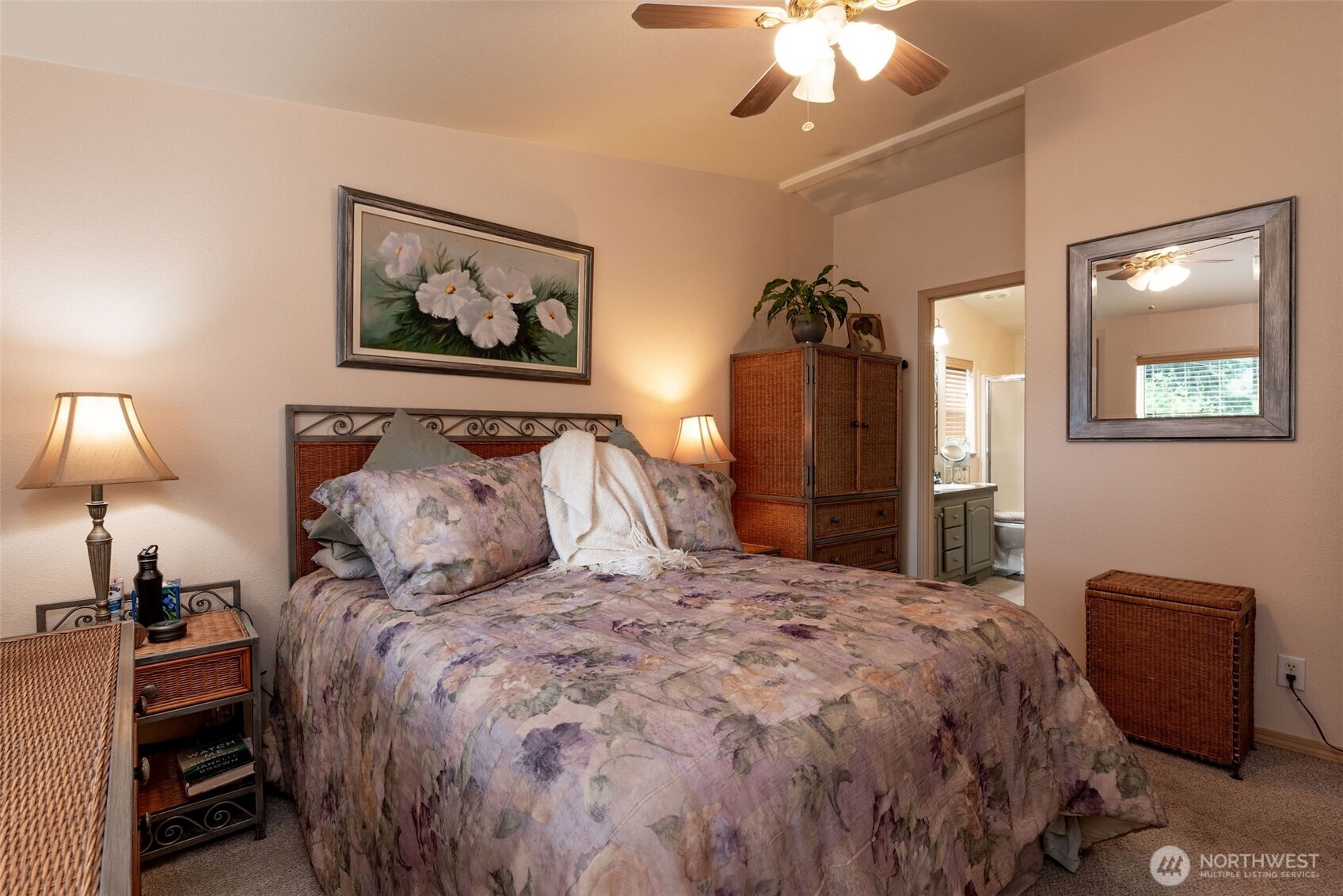 600 Northeast Lincoln Road, Unit 4 Poulsbo, WA 98370 - Photo 14 of 30 a bedroom with a bed and a chandelier