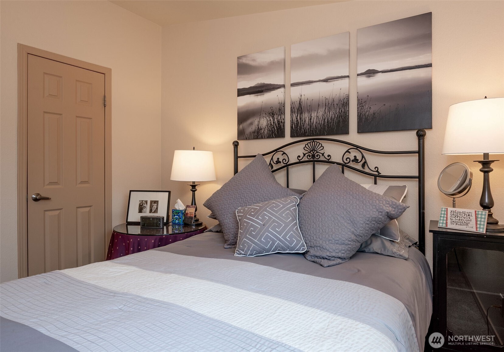 600 Northeast Lincoln Road, Unit 4 Poulsbo, WA 98370 - Photo 19 of 30 a bedroom with a bed and chandelier