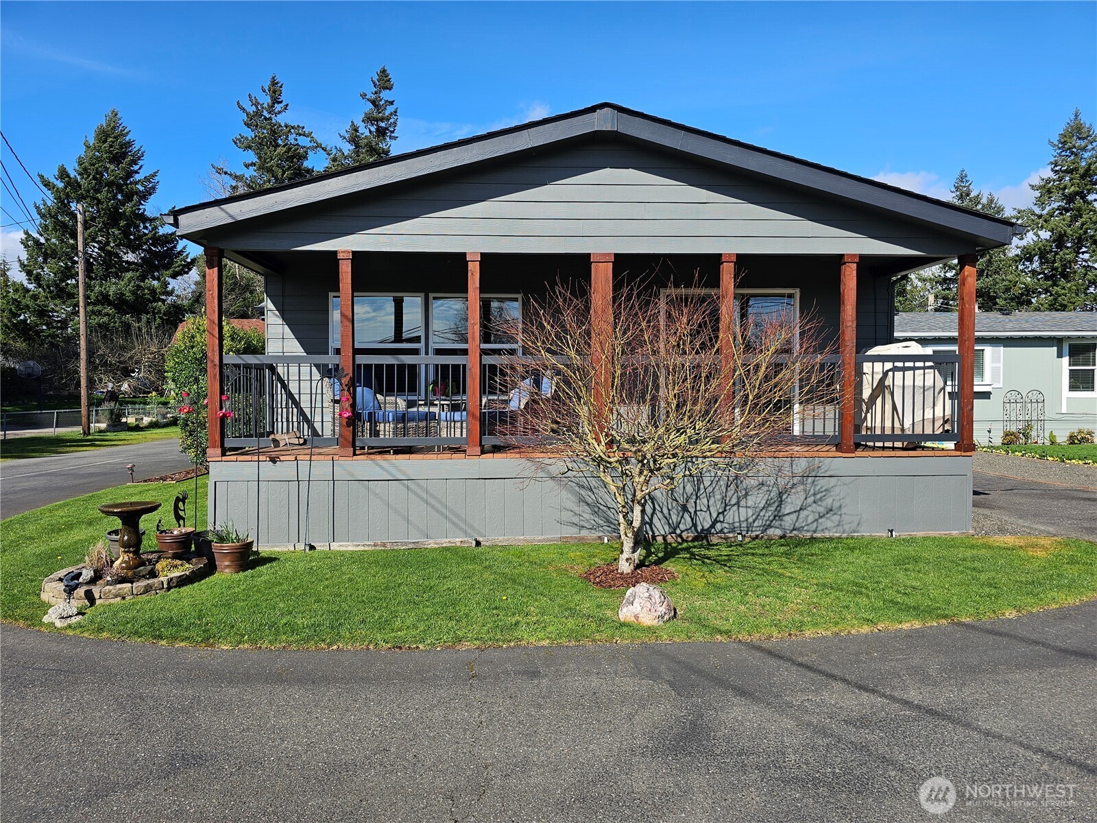 600 Northeast Lincoln Road, Unit 4 Poulsbo, WA 98370 - Photo 2 of 30 a front view of a house with a yard
