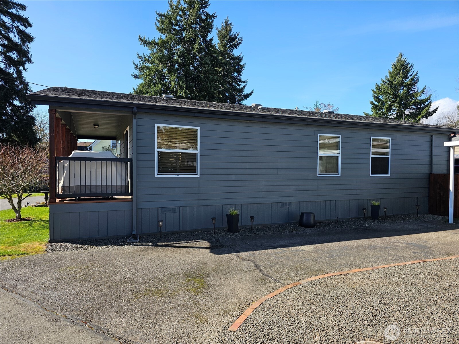 600 Northeast Lincoln Road, Unit 4 Poulsbo, WA 98370 - Photo 28 of 30 a front view of a house with a yard