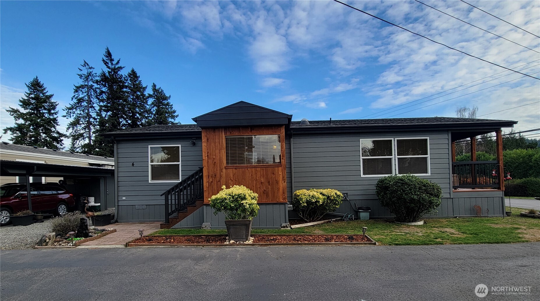 600 Northeast Lincoln Road, Unit 4 Poulsbo, WA 98370 - Photo 4 of 30 a front view of a house with garden