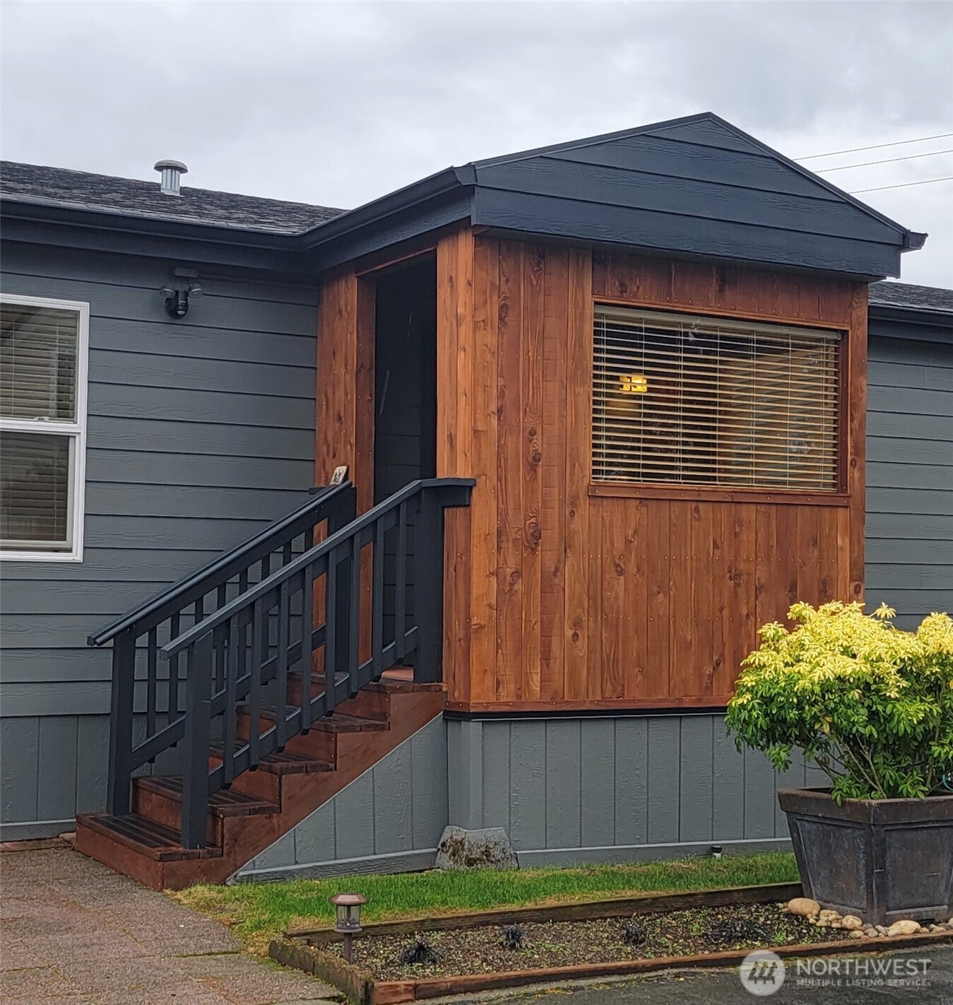 600 Northeast Lincoln Road, Unit 4 Poulsbo, WA 98370 - Photo 5 of 30 a view of wooden house with a small yard