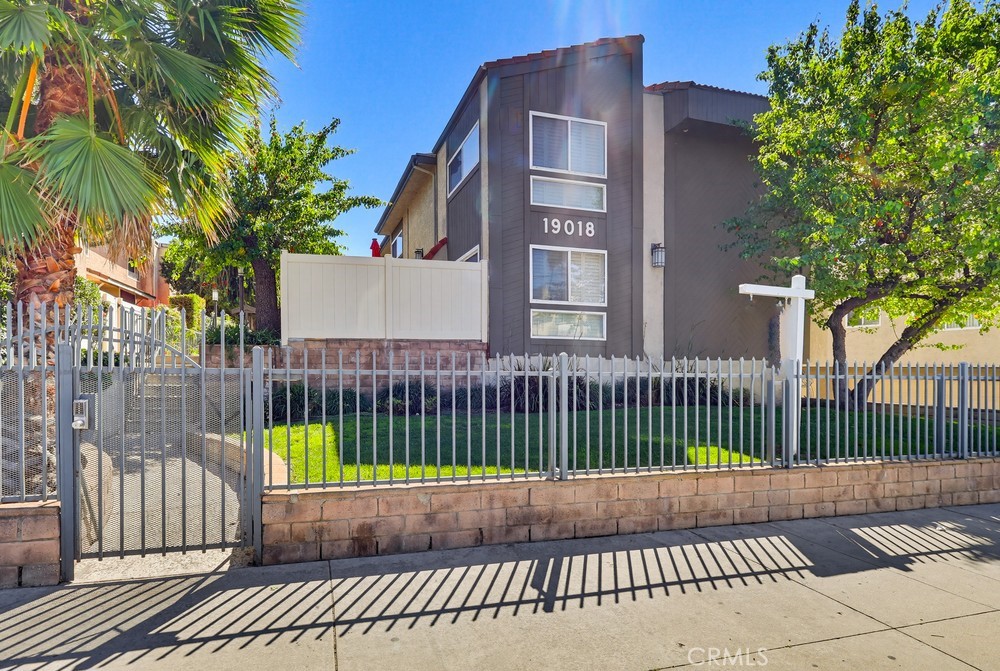 19018 Sherman Way, Unit 110 Reseda, CA 91335 - Photo 1 of 68 a front view of a house