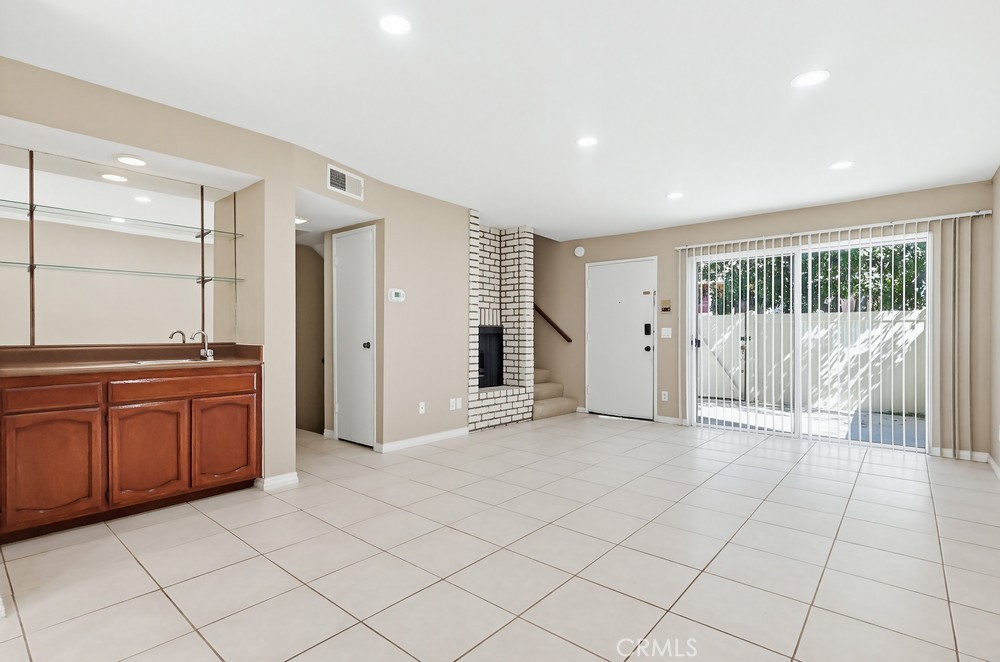 19018 Sherman Way, Unit 110 Reseda, CA 91335 - Photo 13 of 68 a view of a kitchen with a sink and a large window