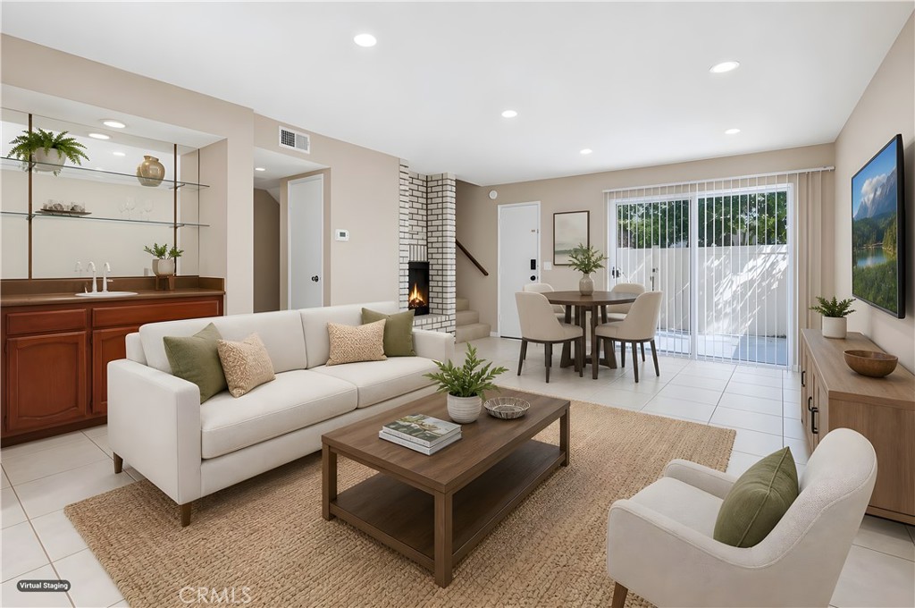 19018 Sherman Way, Unit 110 Reseda, CA 91335 - Photo 14 of 68 a living room with furniture and a large window