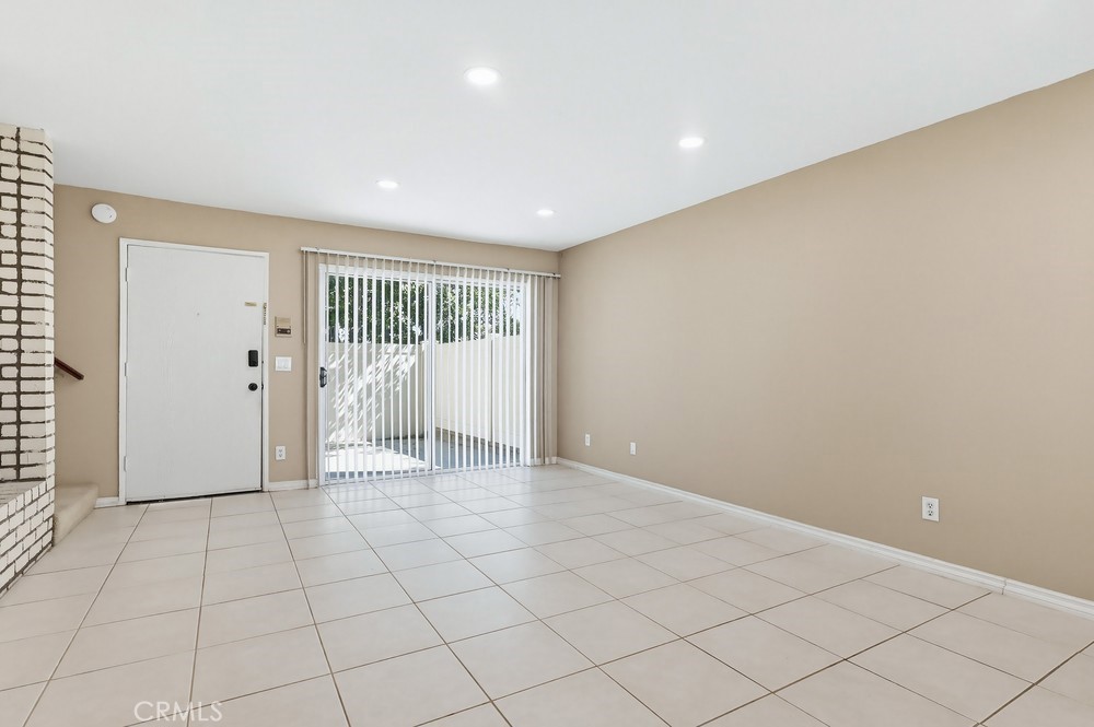19018 Sherman Way, Unit 110 Reseda, CA 91335 - Photo 15 of 68 a view of an empty room with a window