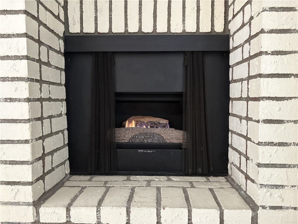 19018 Sherman Way, Unit 110 Reseda, CA 91335 - Photo 16 of 68 a view of fireplace and front door