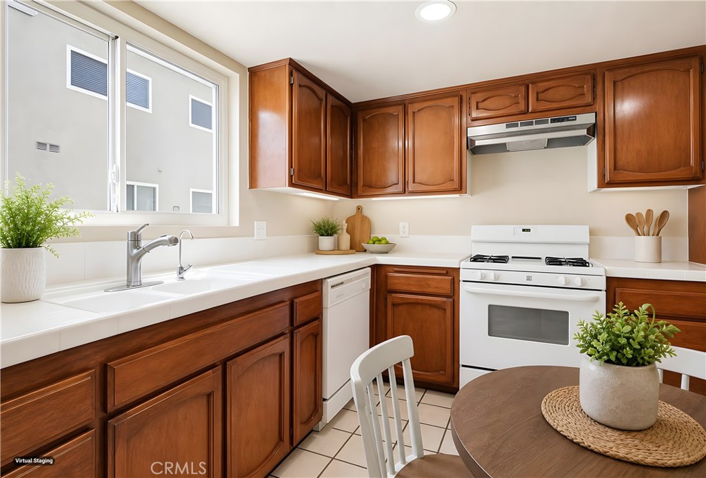 19018 Sherman Way, Unit 110 Reseda, CA 91335 - Photo 20 of 68 a kitchen with a sink and a stove top oven