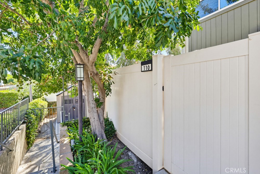 19018 Sherman Way, Unit 110 Reseda, CA 91335 - Photo 2 of 68 a backyard of a house with lots of green space
