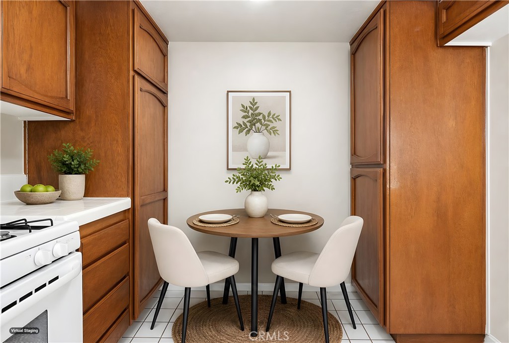 19018 Sherman Way, Unit 110 Reseda, CA 91335 - Photo 23 of 68 a view of a dining room with furniture and wooden floor