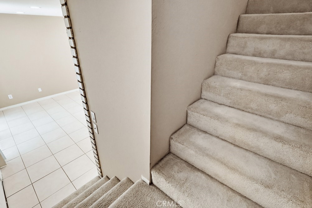 19018 Sherman Way, Unit 110 Reseda, CA 91335 - Photo 27 of 68 a view of staircase with white walls