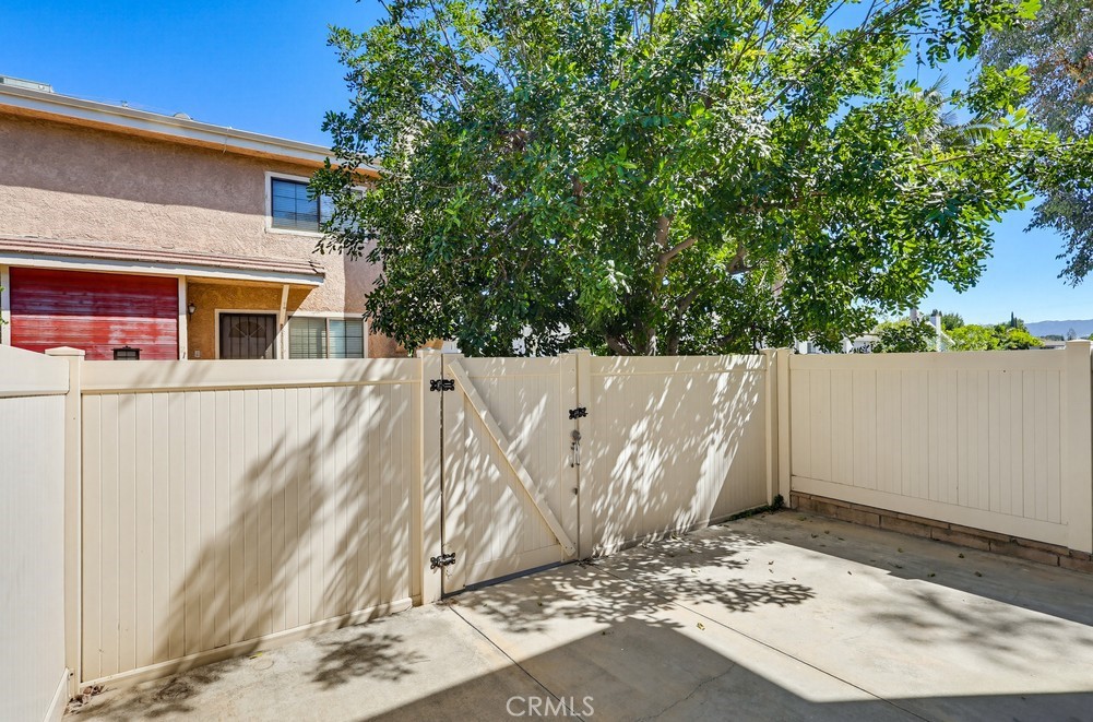 19018 Sherman Way, Unit 110 Reseda, CA 91335 - Photo 3 of 68 a view of a house with a tree