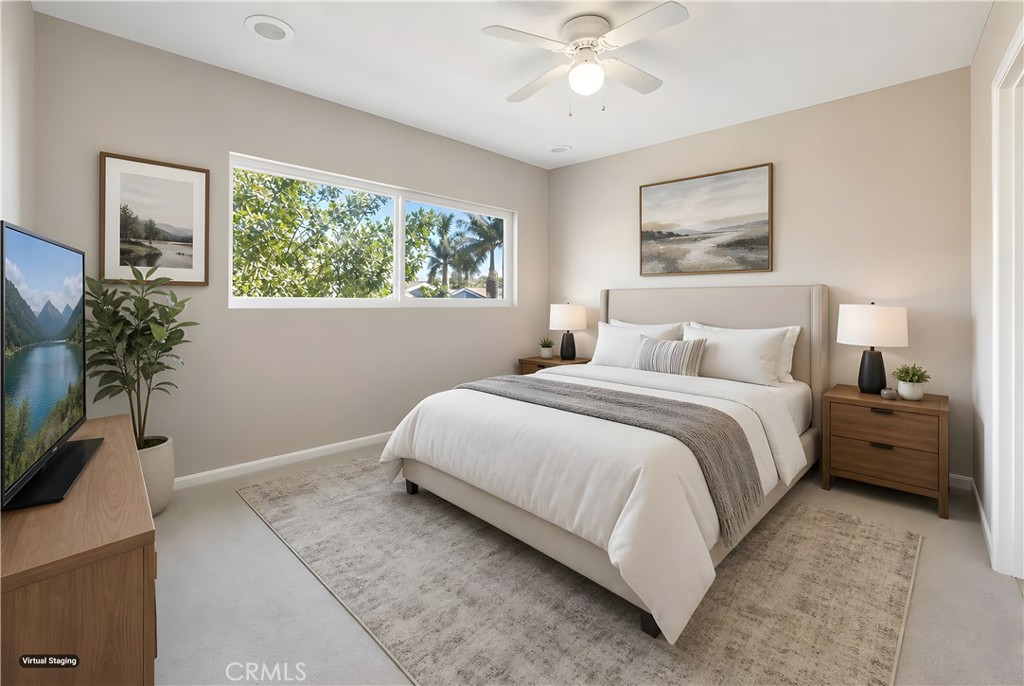 19018 Sherman Way, Unit 110 Reseda, CA 91335 - Photo 32 of 68 a bedroom with a large bed and a window