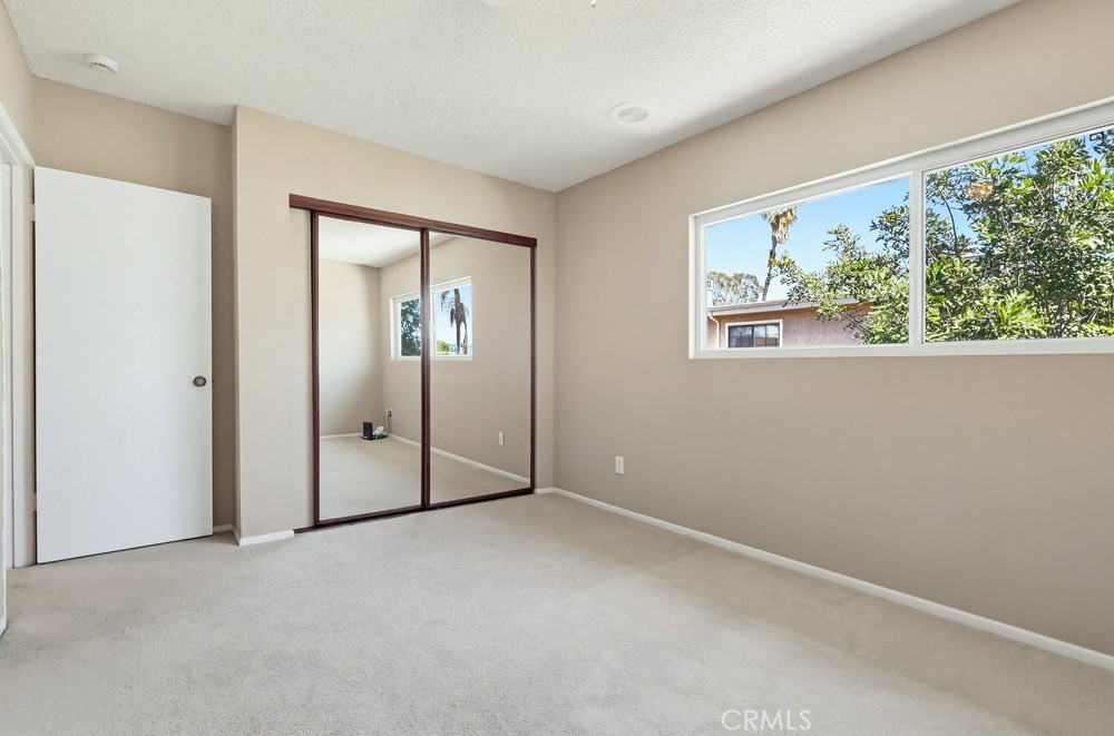 19018 Sherman Way, Unit 110 Reseda, CA 91335 - Photo 33 of 68 an empty room with windows